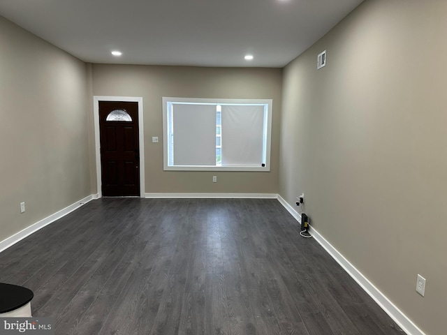 foyer entrance with dark hardwood / wood-style floors