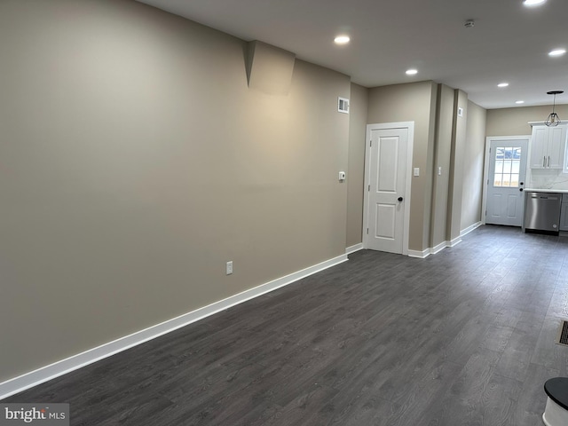 unfurnished room featuring dark wood-type flooring