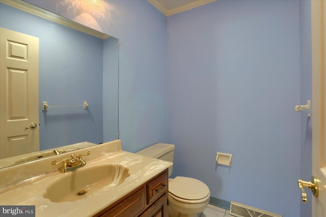 bathroom with vanity, crown molding, toilet, and tile patterned floors