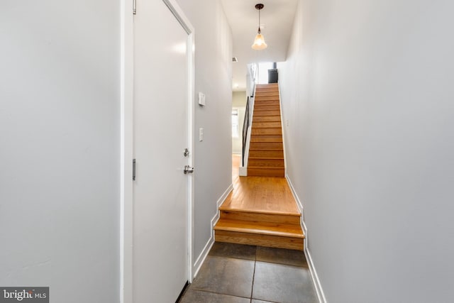 stairway with tile patterned flooring