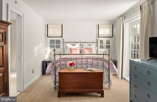 bedroom featuring light colored carpet