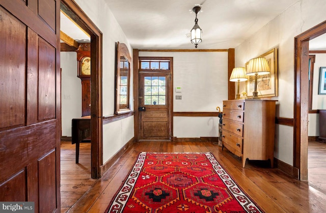 entryway with hardwood / wood-style floors