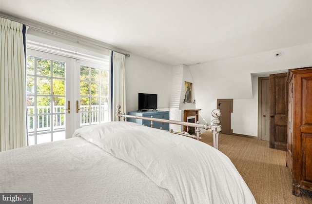 carpeted bedroom featuring access to outside and french doors