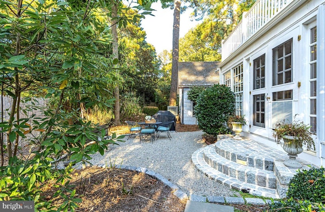 view of patio featuring a balcony