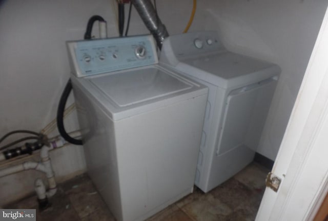 washroom with washer and clothes dryer