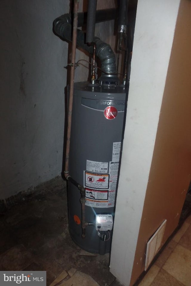 utility room with water heater