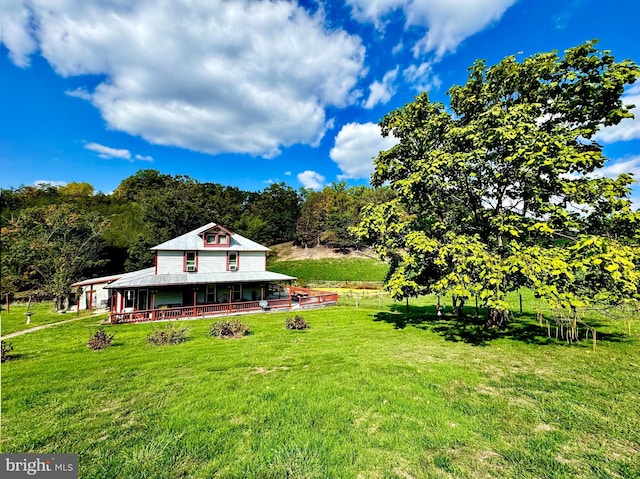 view of yard with a rural view