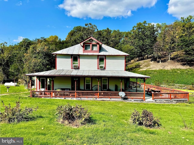 farmhouse inspired home with a front lawn