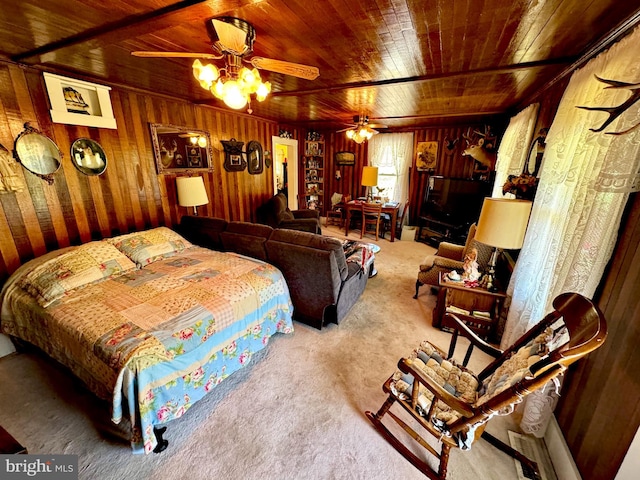 bedroom featuring wood walls, ceiling fan, wooden ceiling, and carpet floors