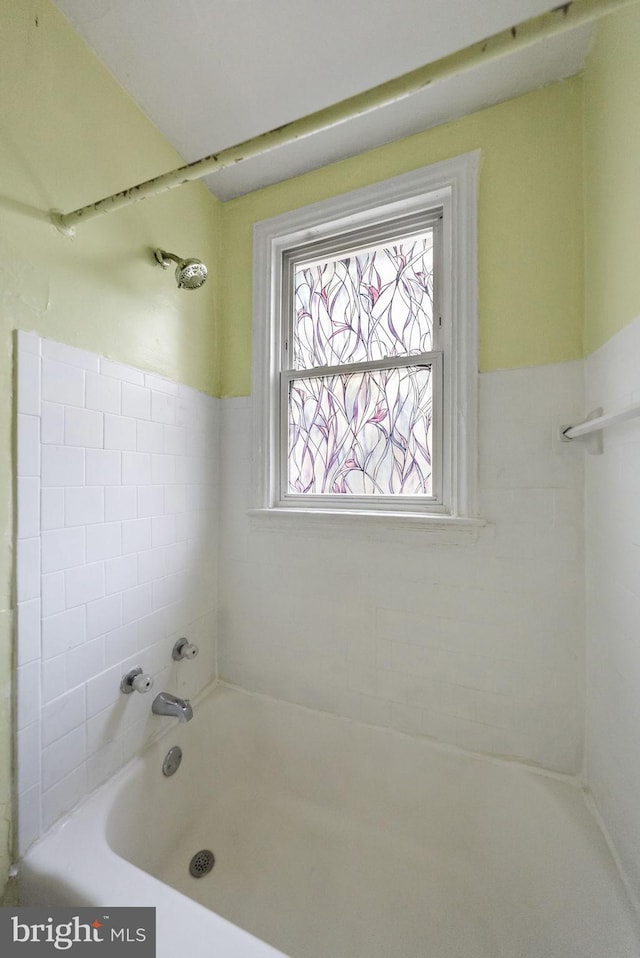 bathroom featuring separate shower and tub