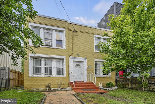 view of front of property with a front lawn