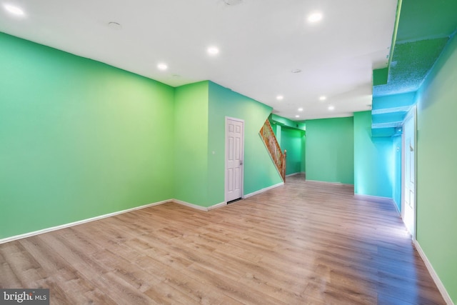 unfurnished room with light hardwood / wood-style floors