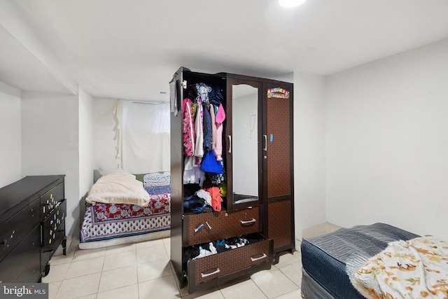 bedroom featuring light tile patterned floors