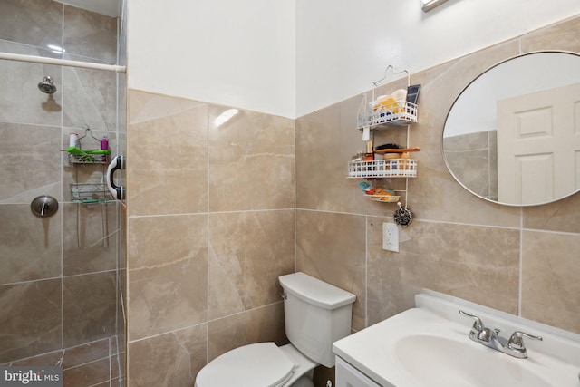 bathroom with walk in shower, tile walls, vanity, and toilet