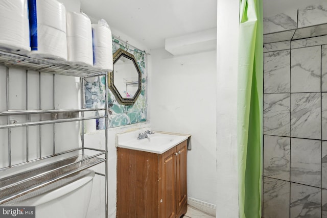 bathroom with vanity and toilet