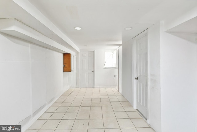 hall with light tile patterned flooring