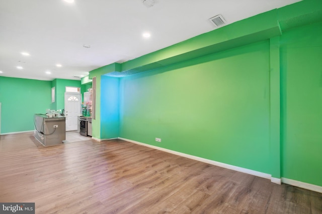 unfurnished living room featuring light hardwood / wood-style flooring