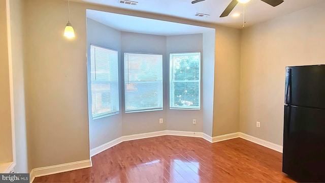 interior space with ceiling fan and hardwood / wood-style flooring