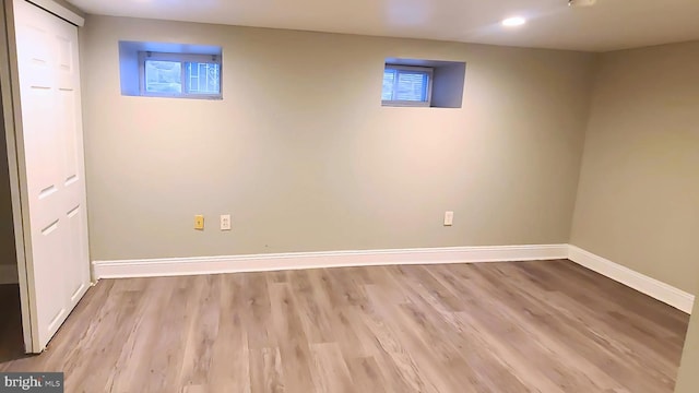 basement featuring light hardwood / wood-style flooring