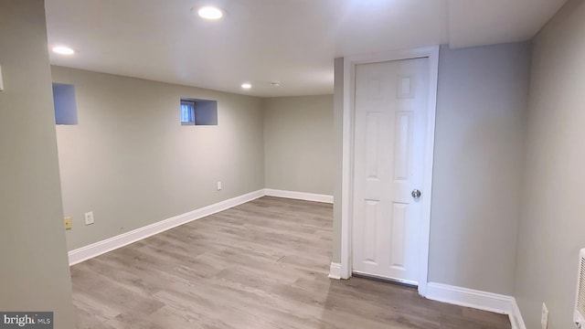 basement featuring light hardwood / wood-style flooring