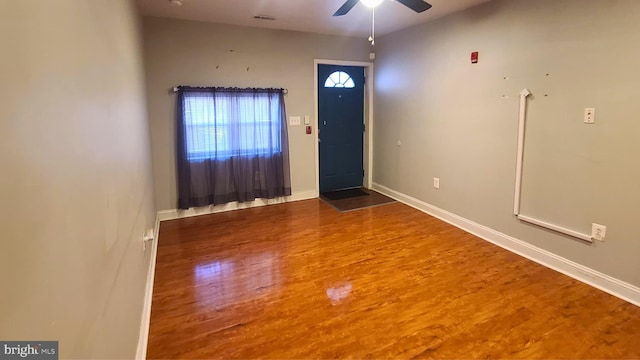 foyer with hardwood / wood-style floors and ceiling fan