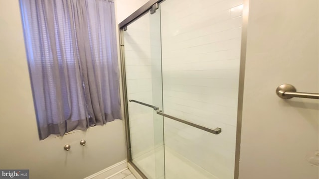 bathroom featuring an enclosed shower