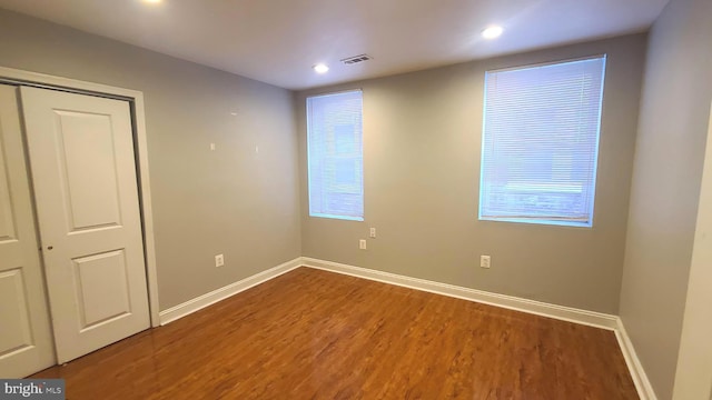 spare room with hardwood / wood-style floors