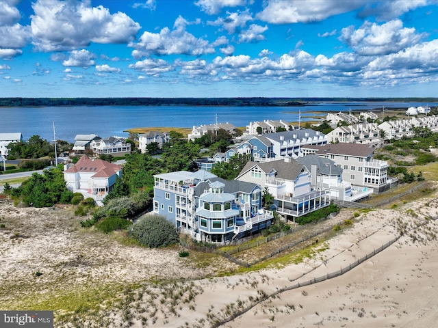 aerial view with a view of the beach and a water view