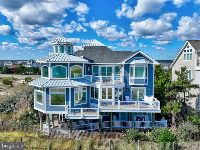 rear view of house featuring a balcony