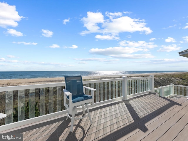 deck with a water view and a view of the beach