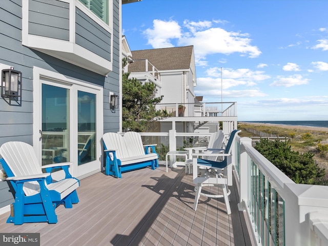 deck featuring a water view