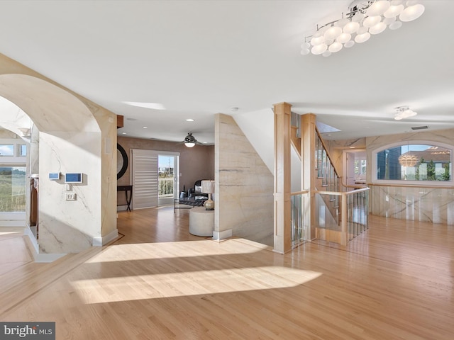 40110 Owens Ct, Fenwick Island, DE 19944 - foyer entrance featuring wood finished floors, a ceiling fan, and a healthy amount of sunlight