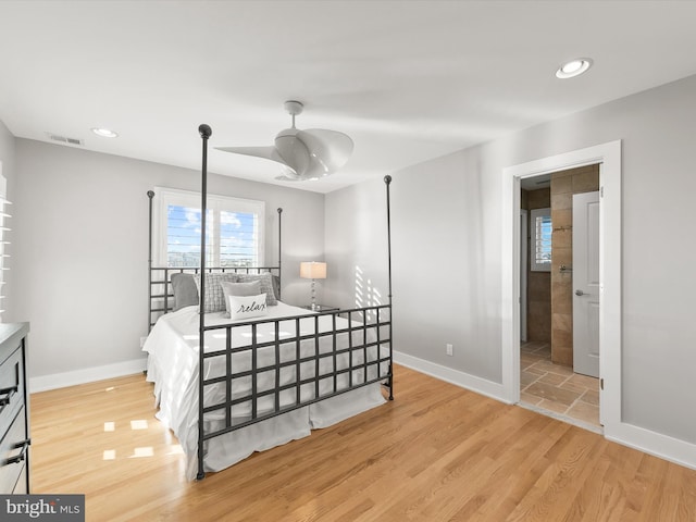 bedroom with light wood-type flooring and ceiling fan