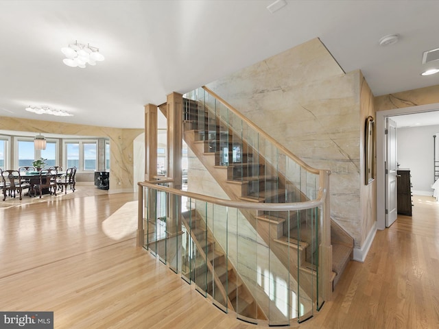 stairway featuring hardwood / wood-style flooring