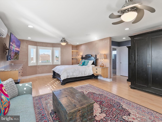 bedroom with ceiling fan and light hardwood / wood-style flooring