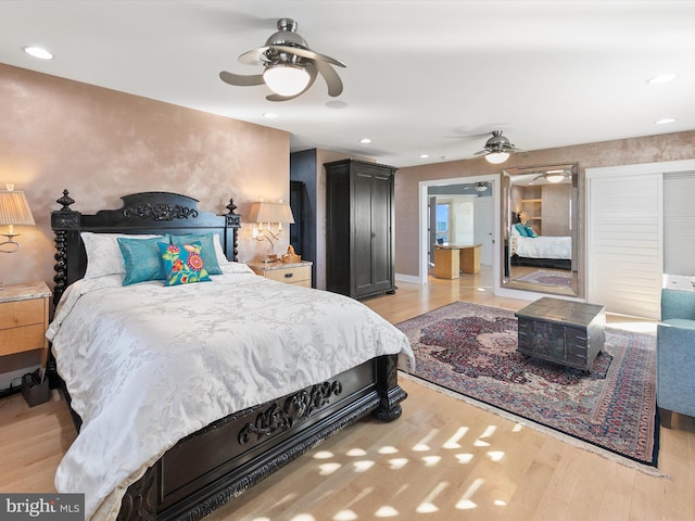 bedroom featuring light hardwood / wood-style floors and ceiling fan