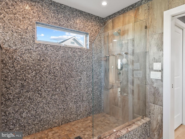 bathroom with a tile shower