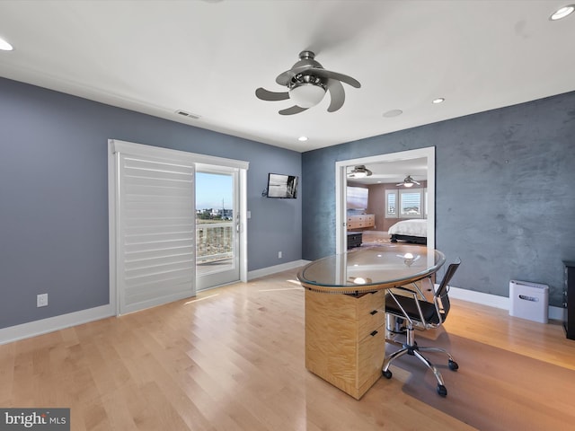 unfurnished office featuring light hardwood / wood-style floors