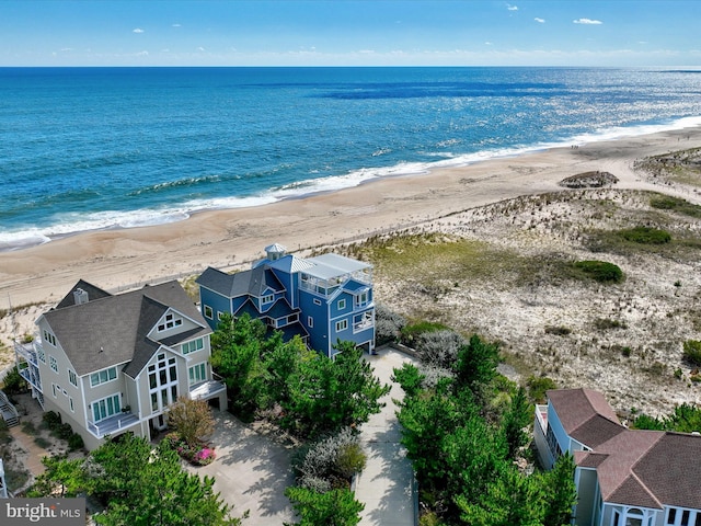 bird's eye view featuring a view of the beach and a water view