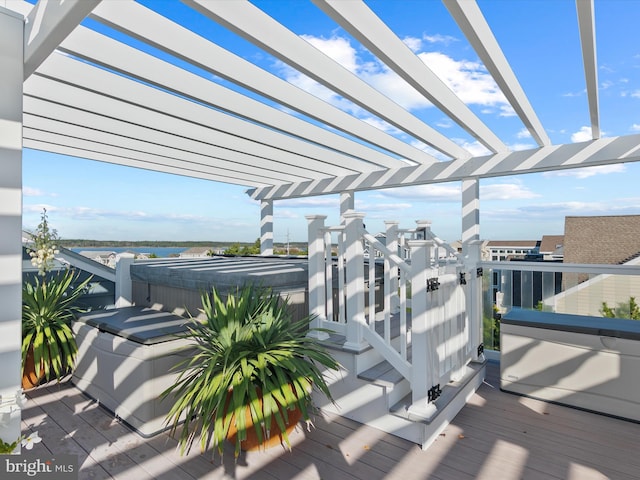 view of patio with a deck, a pergola, and a hot tub