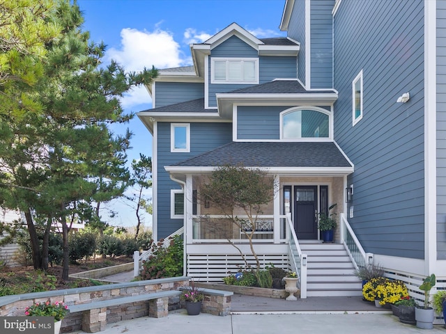 40110 Owens Ct, Fenwick Island, DE 19944 - view of front of house with a porch and roof with shingles