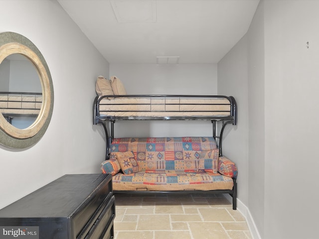 40110 Owens Ct, Fenwick Island, DE 19944 - bedroom with baseboards and stone finish flooring