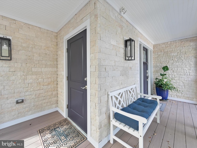 entrance to property featuring covered porch