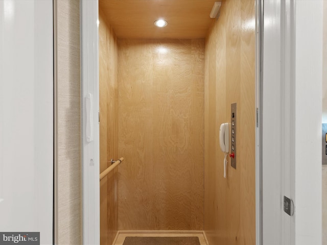 interior details with elevator and wooden walls