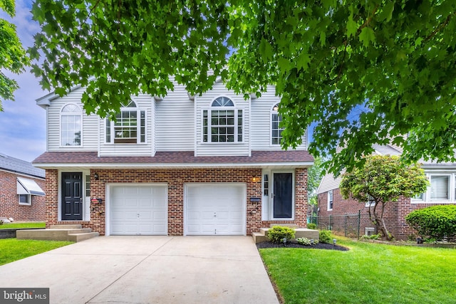 view of front of house with a garage and a front yard