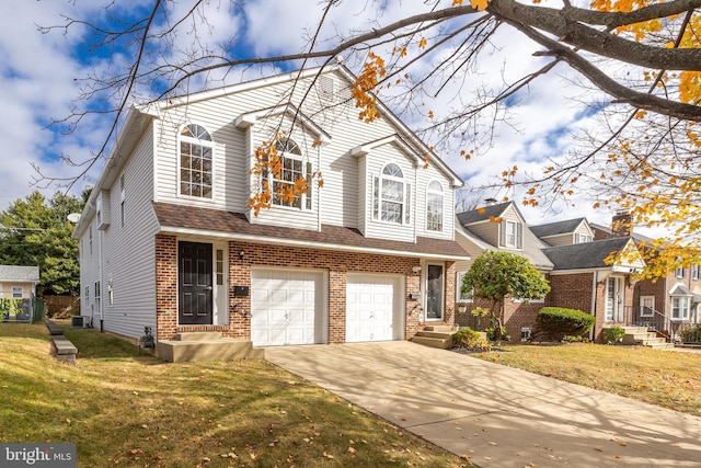 view of front of property featuring a garage and a front yard