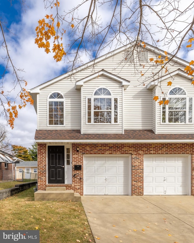 view of front facade featuring a garage and a front yard