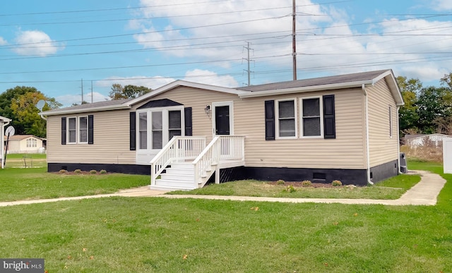 manufactured / mobile home with a front yard