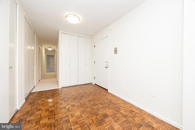 empty room with parquet flooring