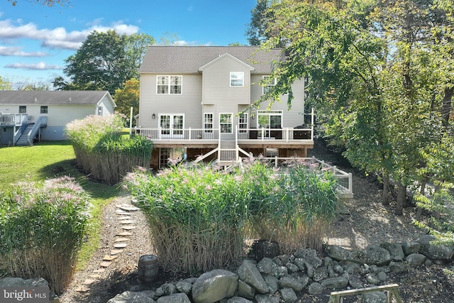 rear view of house with a wooden deck